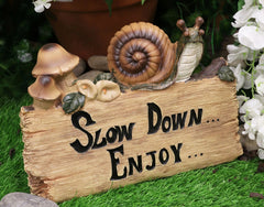 Helix Shell Snail By Mushrooms On Trunk Log With Slow Down Enjoy Sign-1